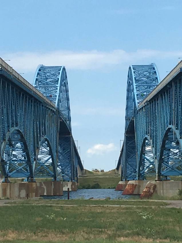 Walking beneath huge blue freeway bridges which go to Grand Island