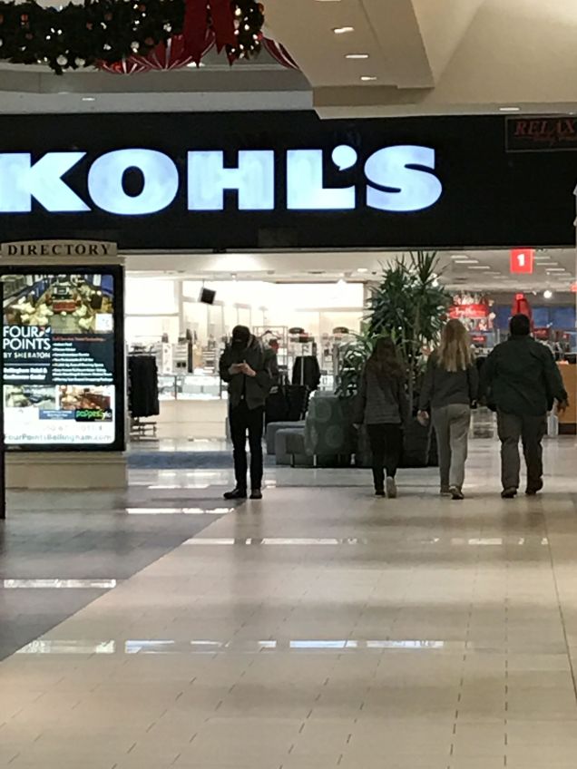 Family of three walking at Bellis Fair Mall