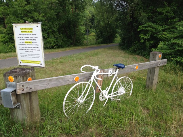 Ghost Bike at busy highway crossing on the trial